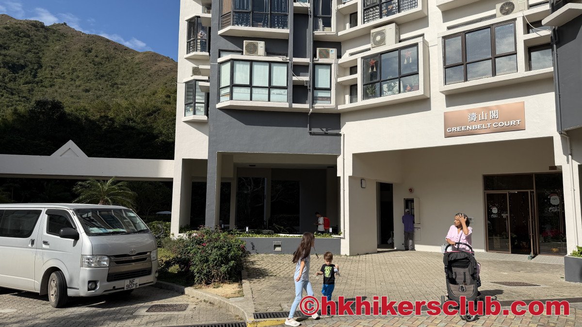 To reach the entrance to the trail path, you'll need to go behind this building by taking the pathway on the left of the main building entrance.
