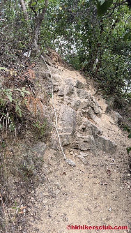 And to our surprise, on the last mile we have to climb some real rocks secured by a rope.