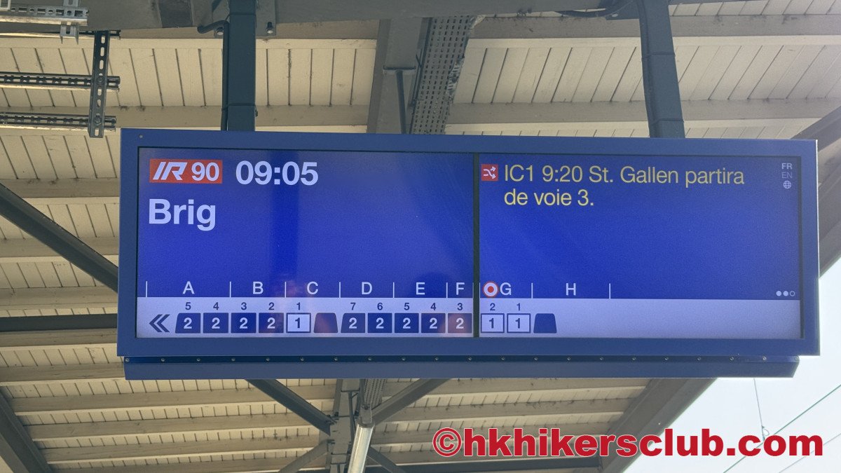 The direction to Visp is take the train to Brig. The box on the sign at the bottom with the 1 or 2 indicates 1st class(white box) or 2nd class(blue box) ticket and the related letter(A B etc) of where to board on the platform.